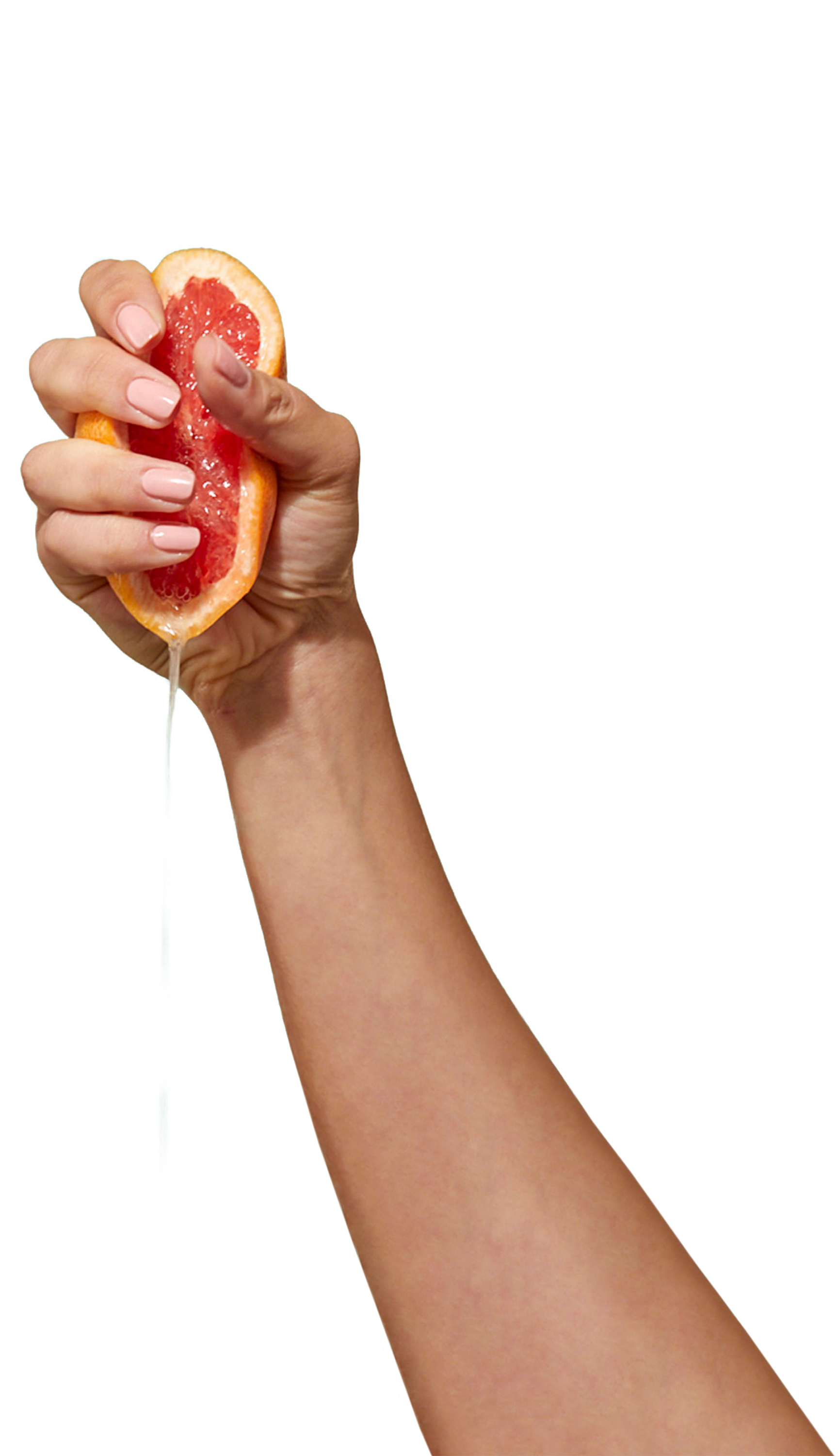 CARE halbe Grapefruit wird in einer Hand ausgedrückt
