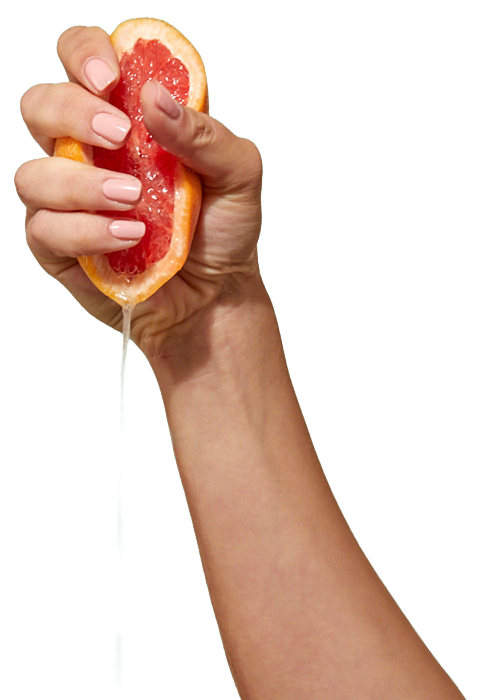 CARE halbe Grapefruit wird in einer Hand ausgepresst